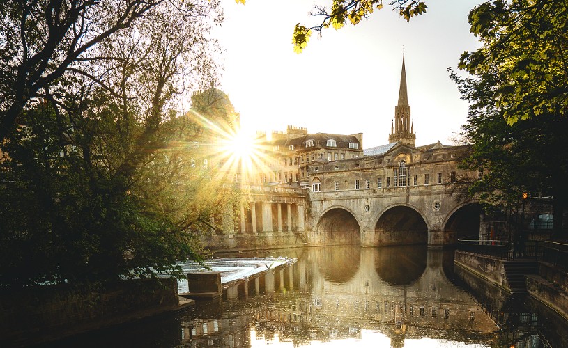 Pulteney Bridge with sun shining through buildings